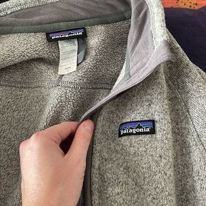 Men zip up Patagonia